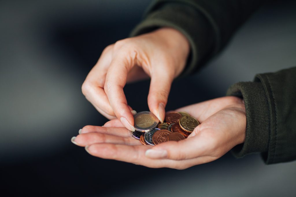 Euro coins in female hand